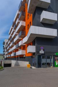 a building with an orange and white building at Feel At Home in Wrocław