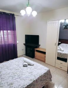 Postel nebo postele na pokoji v ubytování Habitación CID