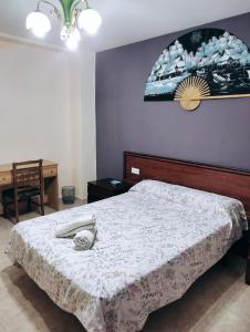 Postel nebo postele na pokoji v ubytování Habitación CID