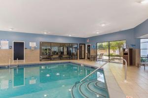 a large swimming pool in a building at Best Western Plus McDonough Inn & Suites in McDonough