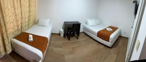 Postel nebo postele na pokoji v ubytování HOTEL EMBASSY STAR