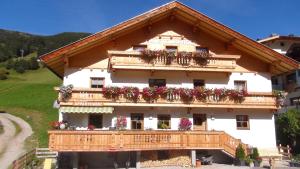 a house with flowers on the balconies of it at Haus Emberger in Gerlos