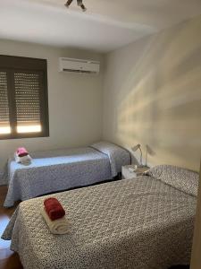 Llit o llits en una habitació de Apartamento en Luis Montoto, Nervión. Céntrico