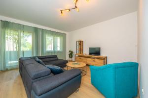 Televízia a/alebo spoločenská miestnosť v ubytovaní Apartments Jarmila