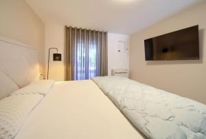 Postel nebo postele na pokoji v ubytování Apartment Siora + 12 fotografií