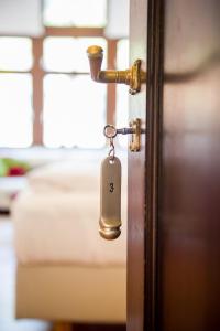 a door with a padlock on it at Hotel Villa Vinum Cochem in Cochem