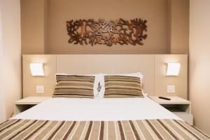 Cama ou camas em um quarto em Lagoon Prime Hotel