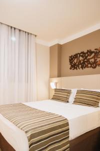 Cama ou camas em um quarto em Lagoon Prime Hotel