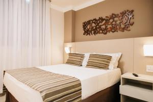 Cama ou camas em um quarto em Lagoon Prime Hotel