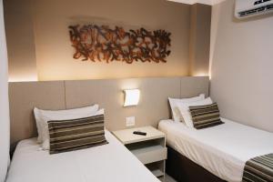 Cama ou camas em um quarto em Lagoon Prime Hotel
