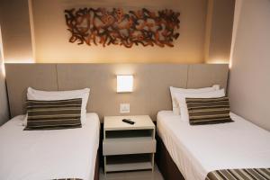 Cama ou camas em um quarto em Lagoon Prime Hotel