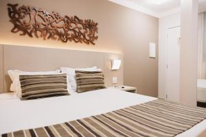 Cama ou camas em um quarto em Lagoon Prime Hotel