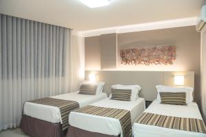 Cama ou camas em um quarto em Lagoon Prime Hotel