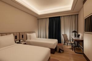 Sayarsan Hotel Yangon客房内的一张或多张床位