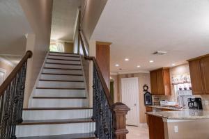 a spiral staircase in a kitchen with a stair case at ~~ Big Family Home near 99 / i10 / kid friendly~~ in Katy +27 photos