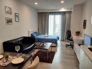 a living room with a couch and a bed in a room at City Home Suites Kuala Lumpur City Centre in Kuala Lumpur