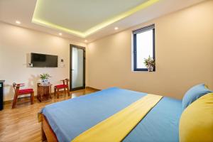Postel nebo postele na pokoji v ubytování Nam Hội Homestay