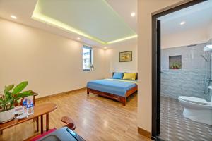 Postel nebo postele na pokoji v ubytování Nam Hội Homestay
