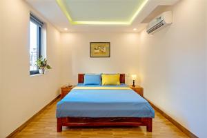 Postel nebo postele na pokoji v ubytování Nam Hội Homestay