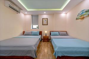 Postel nebo postele na pokoji v ubytování Nam Hội Homestay