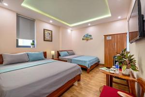 Postel nebo postele na pokoji v ubytování Nam Hội Homestay