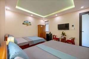 Postel nebo postele na pokoji v ubytování Nam Hội Homestay