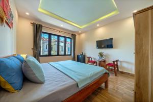 Postel nebo postele na pokoji v ubytování Nam Hội Homestay