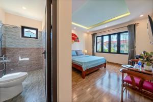Postel nebo postele na pokoji v ubytování Nam Hội Homestay