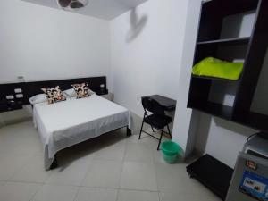 Postel nebo postele na pokoji v ubytování HOTEL SAN ADOLFO