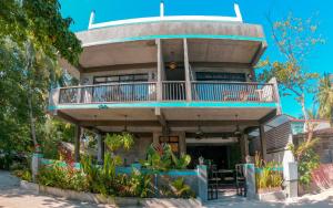 a large house with a balcony on top of it at The Mureed in Fulidhoo