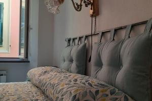 A bed or beds in a room at Le ortensie di Villa Vittoria nel verde a pochi minuti di auto dalle spiagge
