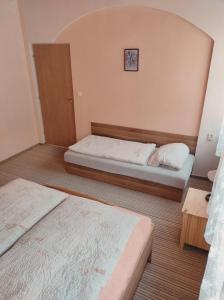 Postel nebo postele na pokoji v ubytování Apartmány Vranov