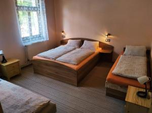 Postel nebo postele na pokoji v ubytování Apartmány Vranov