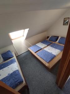Postel nebo postele na pokoji v ubytování Apartmány Vranov