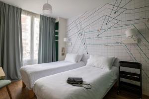 Postel nebo postele na pokoji v ubytování ibis Styles Asnieres Centre
