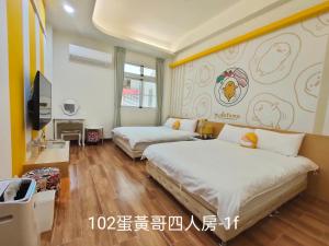 Postel nebo postele na pokoji v ubytování 小雅民宿 Oo自助入住旅店oO