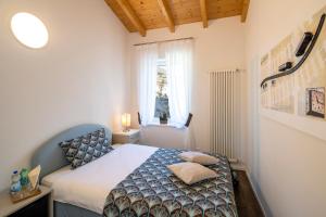 Rúm í herbergi á Albergo Ristorante Stazione Balerna