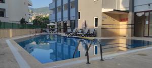 a swimming pool in the middle of a building at Sailor Apart Hotel in Alanya