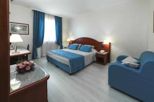 Postel nebo postele na pokoji v ubytování Edra Palace Hotel & Ristorante