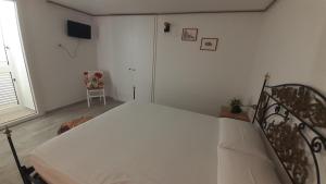 A bed or beds in a room at I Nidi di Colombo
