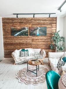 a living room with a couch and a table at Ranna Apartment in Võru