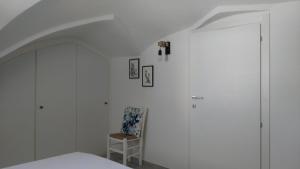 A bed or beds in a room at I Nidi di Colombo