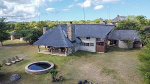 an aerial view of a house with a thatched roof at Zebula 115 in Mabula