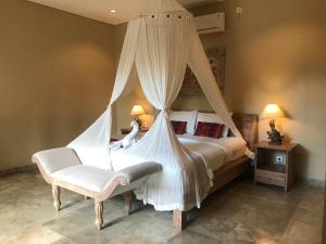 Un ou plusieurs lits dans un hébergement de l'établissement Kailash Bali