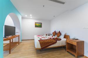 Postel nebo postele na pokoji v ubytování Prime New Hotel