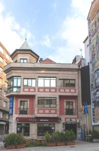 a building in the middle of a city at Santa Clara in Oviedo