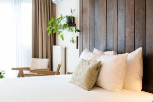 Ein Bett oder Betten in einem Zimmer der Unterkunft Van Heeckeren Hotel