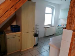 a kitchen with a sink and a counter top at Ferienwohnung Bensdorf in Bensdorf +8 photos