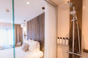 Ein Bett oder Betten in einem Zimmer der Unterkunft Van Heeckeren Hotel
