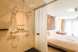 Ein Bett oder Betten in einem Zimmer der Unterkunft Van Heeckeren Hotel
